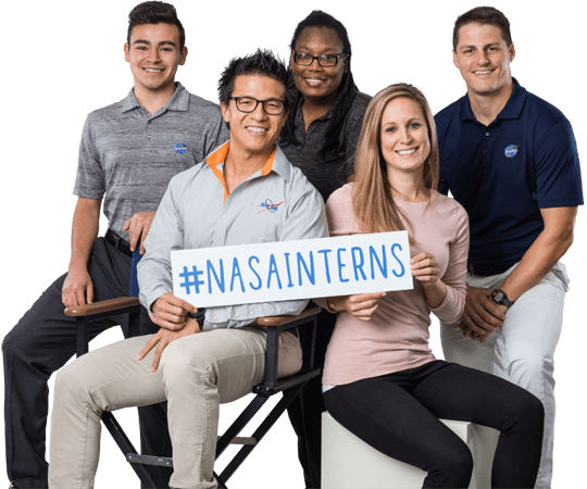 A group of interns holding a hashtag NASA Interns sign.