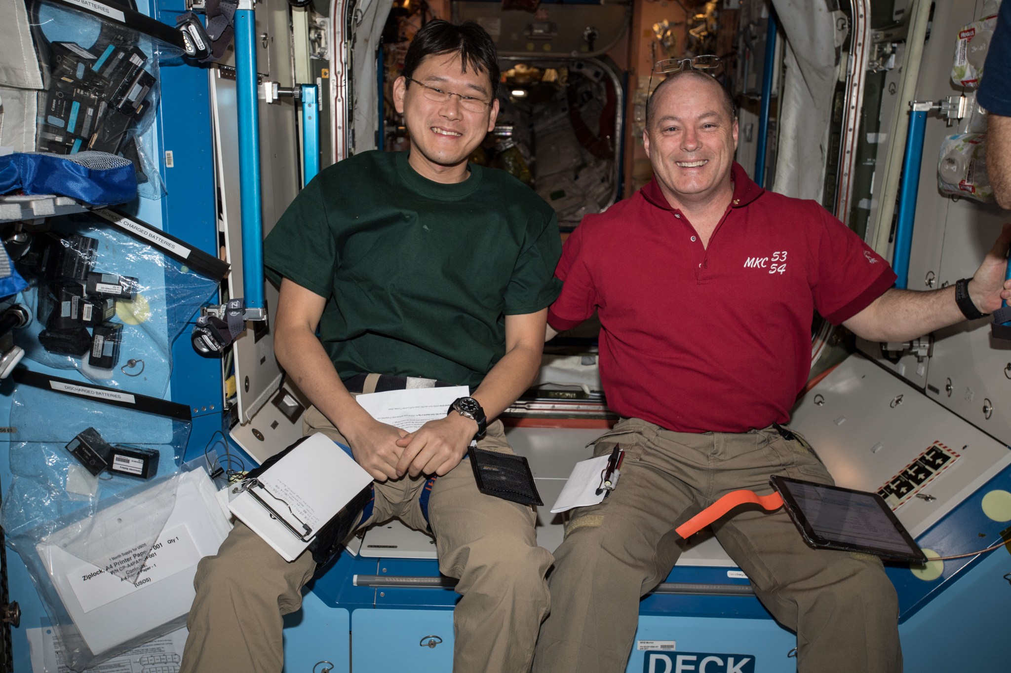 Astronauts Norishige Kanai of the Japan Aerospace Exploration Agency and Scott Tingle of NASA