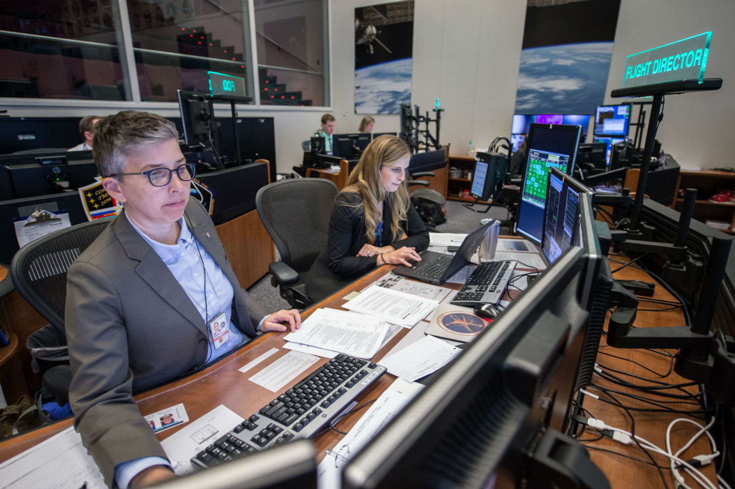 Flight directors work in Mission Control at NASA’s Johnson Space Center in Houston.