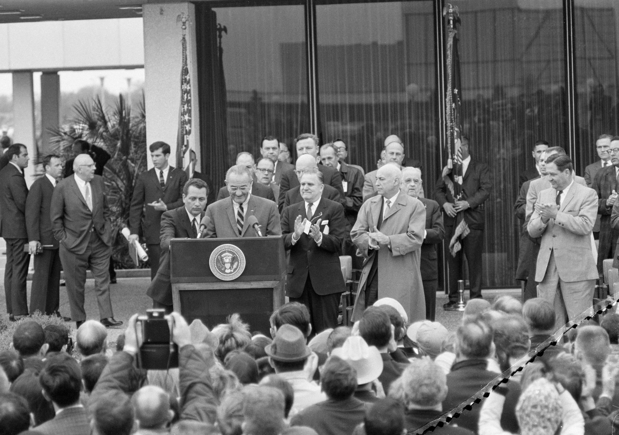 LBJ Speaking in front of building 1