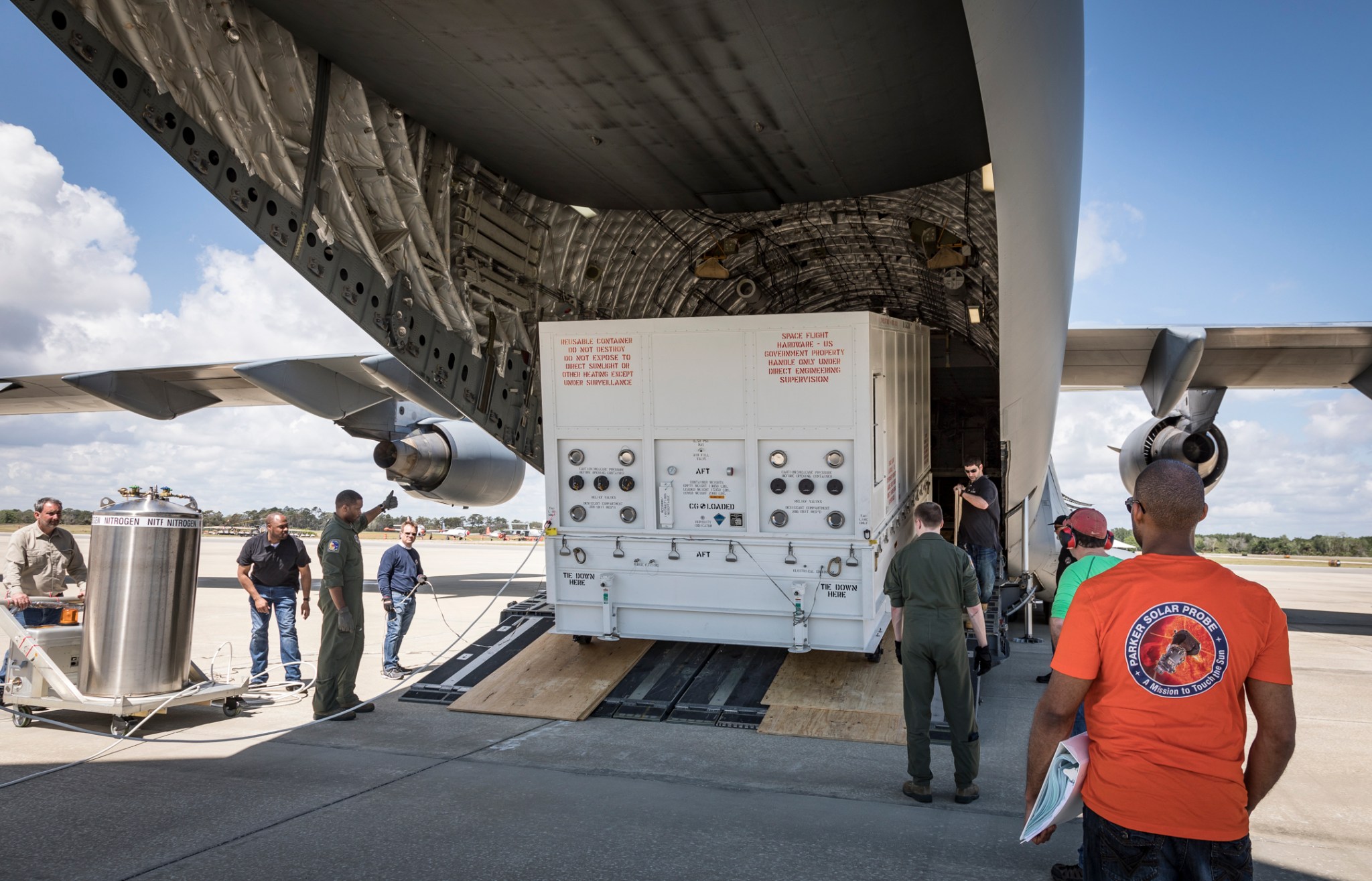 unloading of Parker Solar Probe shipping container from C-17