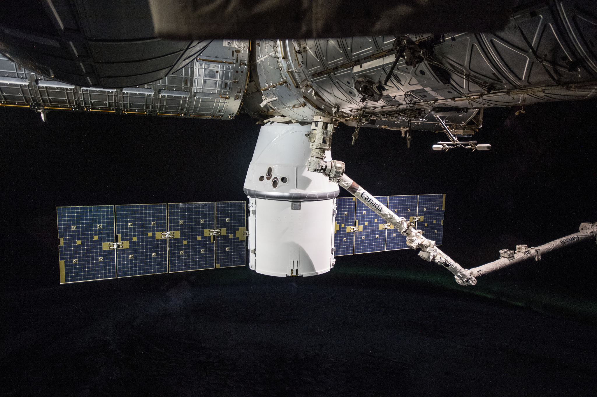 SpaceX Dragon cargo craft attached to the International Space Station's Harmony module.