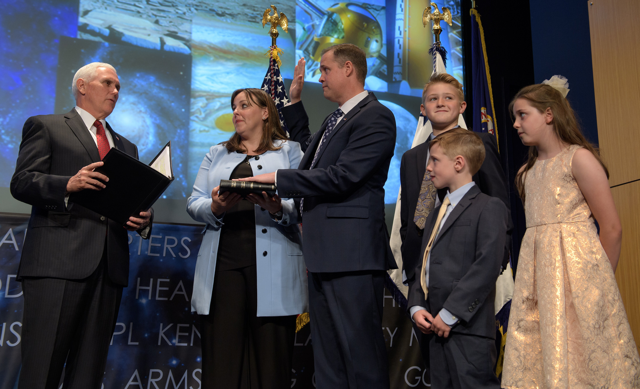Vice President Mike Pence swears in Jim Bridenstine as the 13th NASA Administrator as Bridenstine's family watches.
