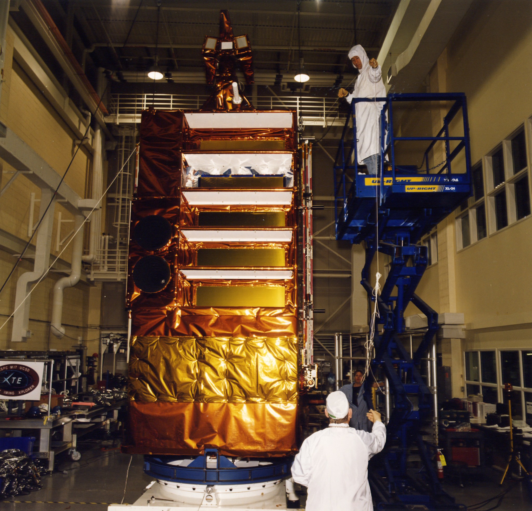 Technicians work on RXTE in 1995.