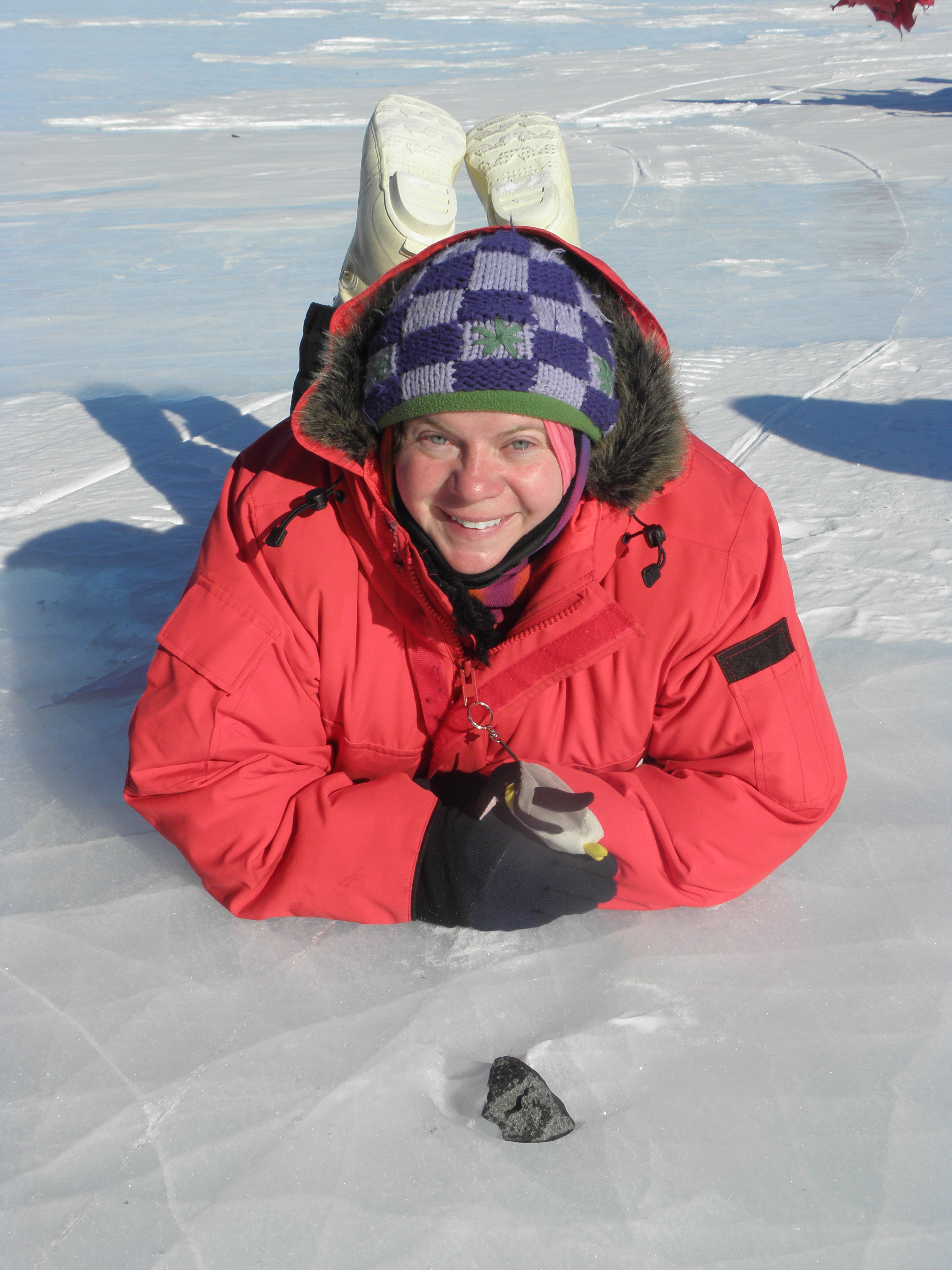 Barbara Cohen with a meteorite on the ice