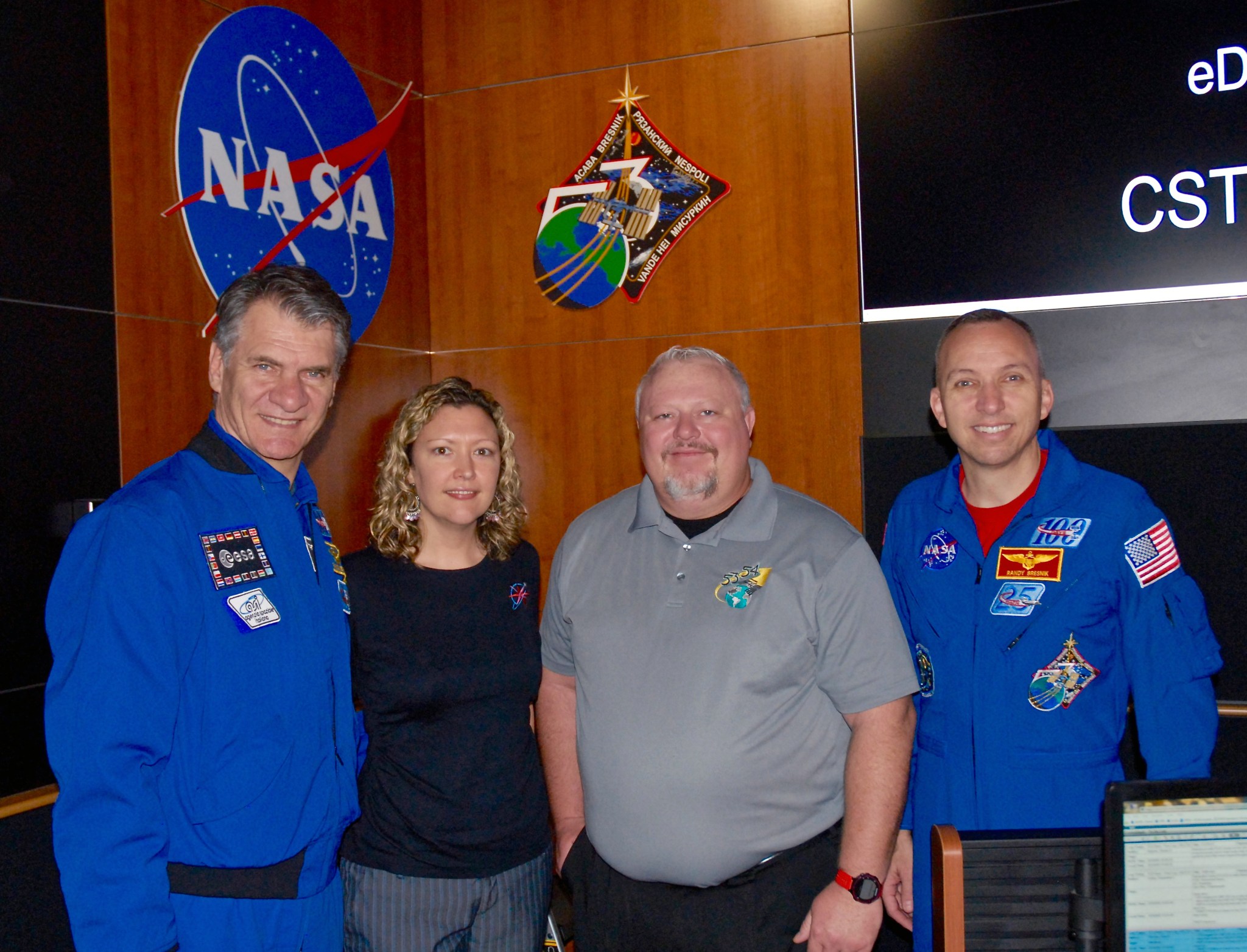 Expedition 53 crewmembers attend a plaque hanging ceremony April 6 inside the Payload Operations Integration Center.