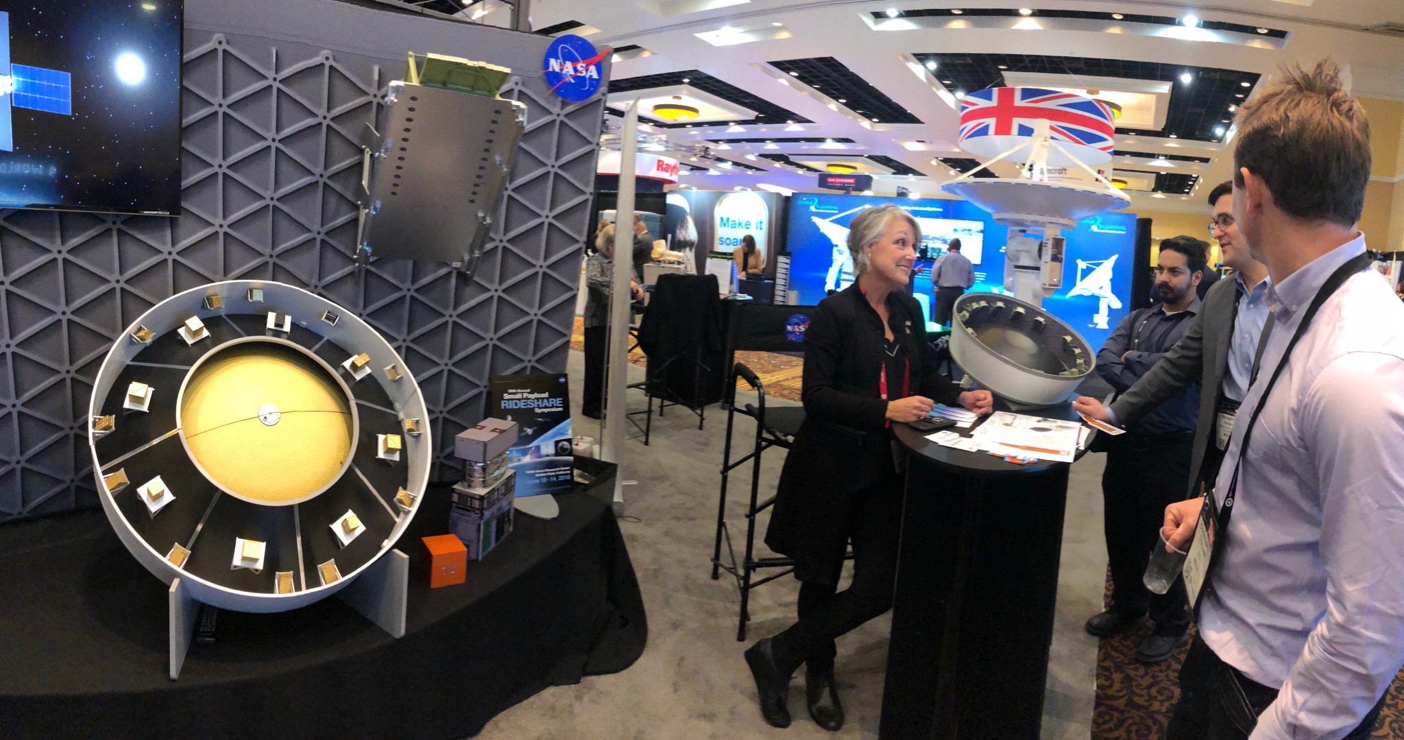 Marcia Lindstrom talks to guests about the Space Launch System and its secondary payloads at the 34th Space Symposium.