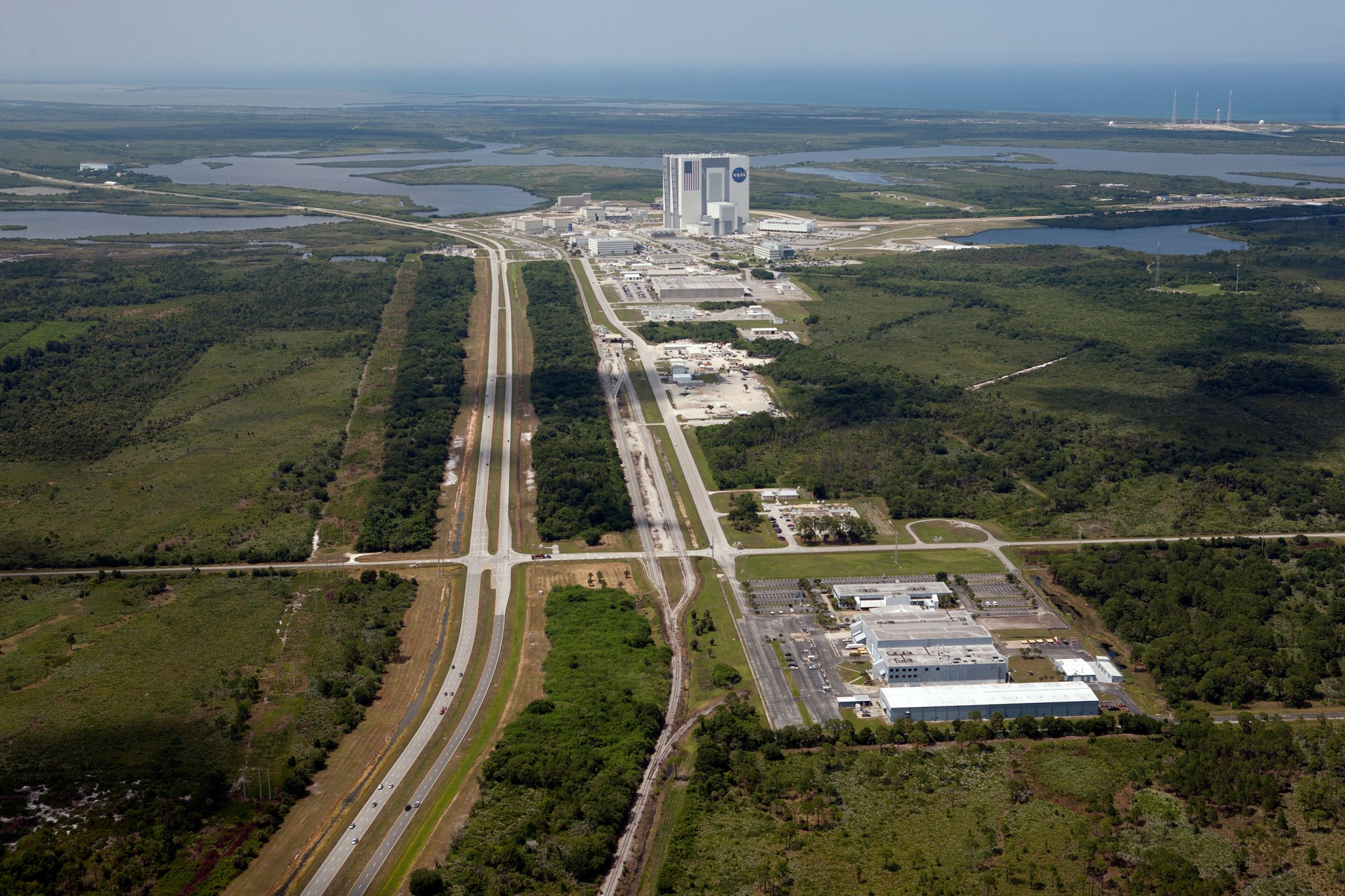 An aerial view of NASA's Kennedy Space Center includes the Vehicle Assembly Building and surrounding areas.