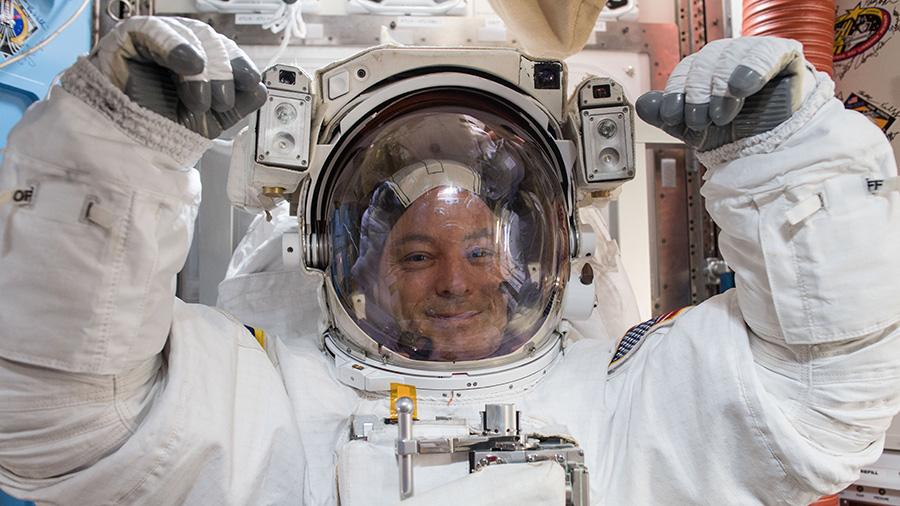 NASA astronaut Scott Tingle prepares for his first spacewalk