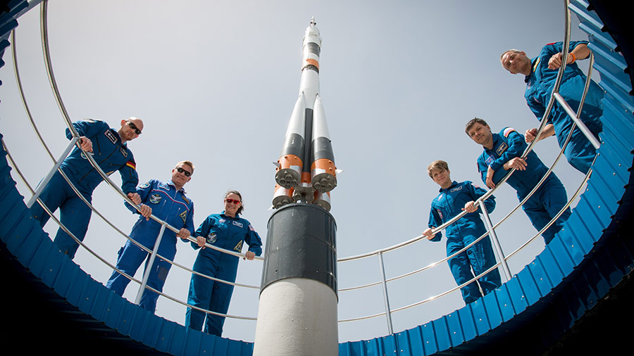 Expedition 56 prime and backup crew members pose for pictures