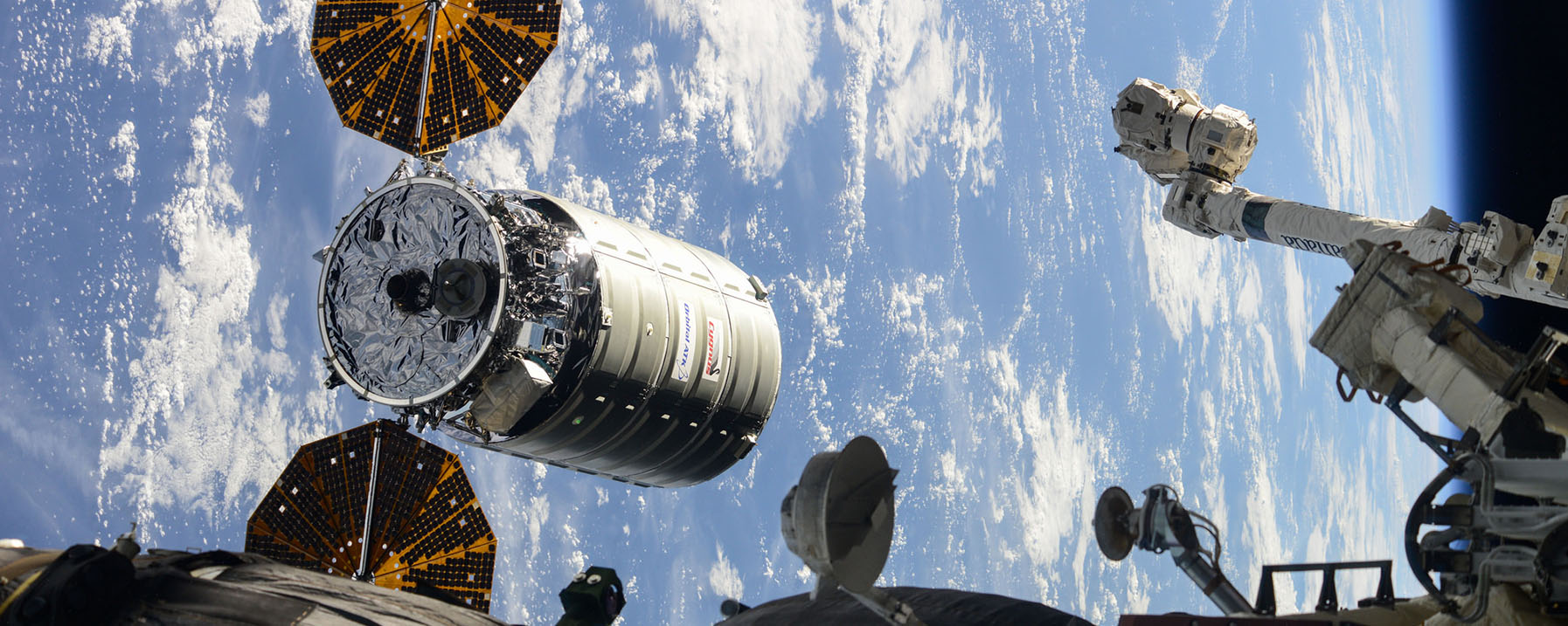 Spacecraft beside International Space Station