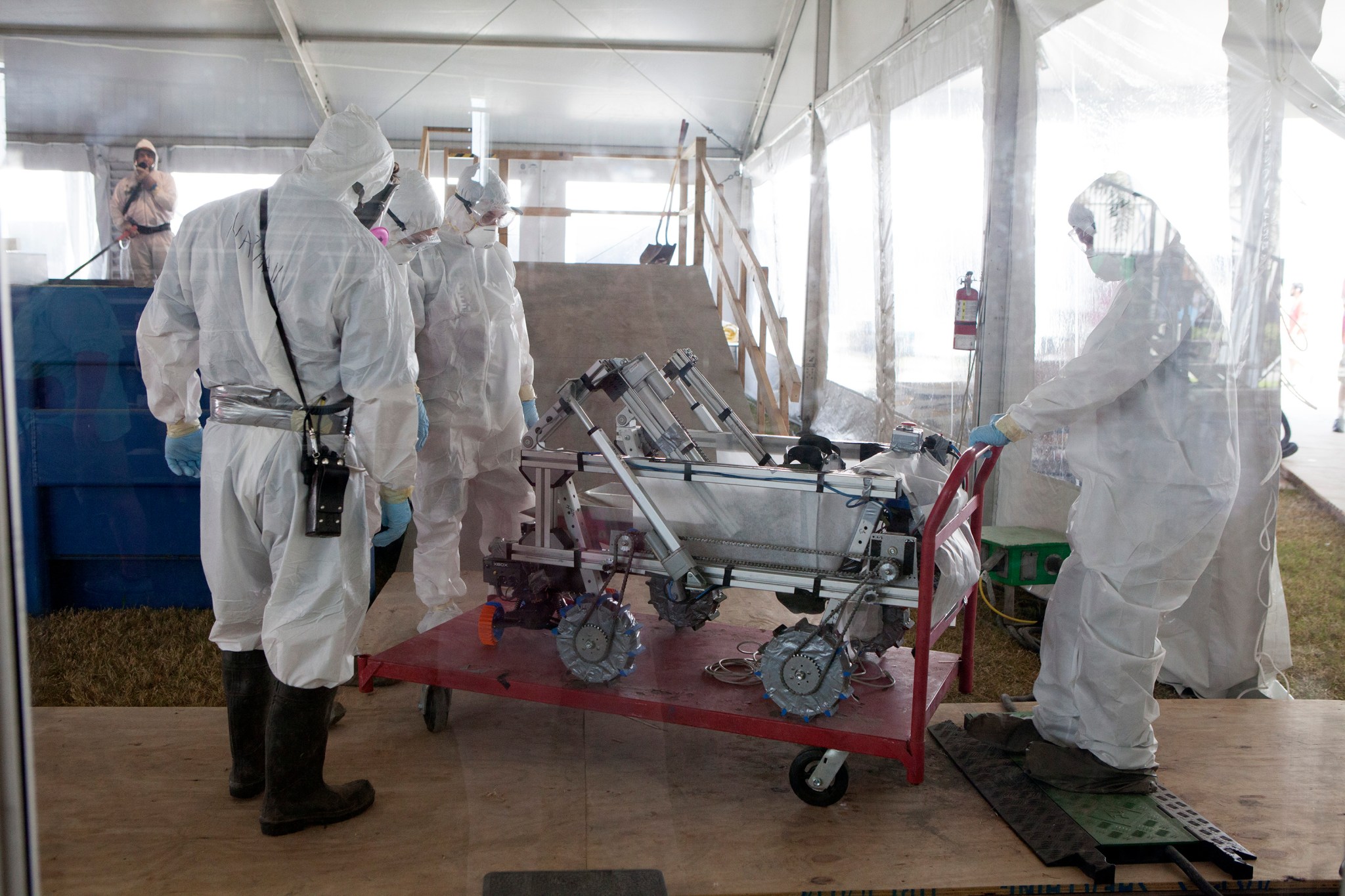 College team members cart their robot miner from the mining arena after a competition run during NASA's 6th Annual RMC.