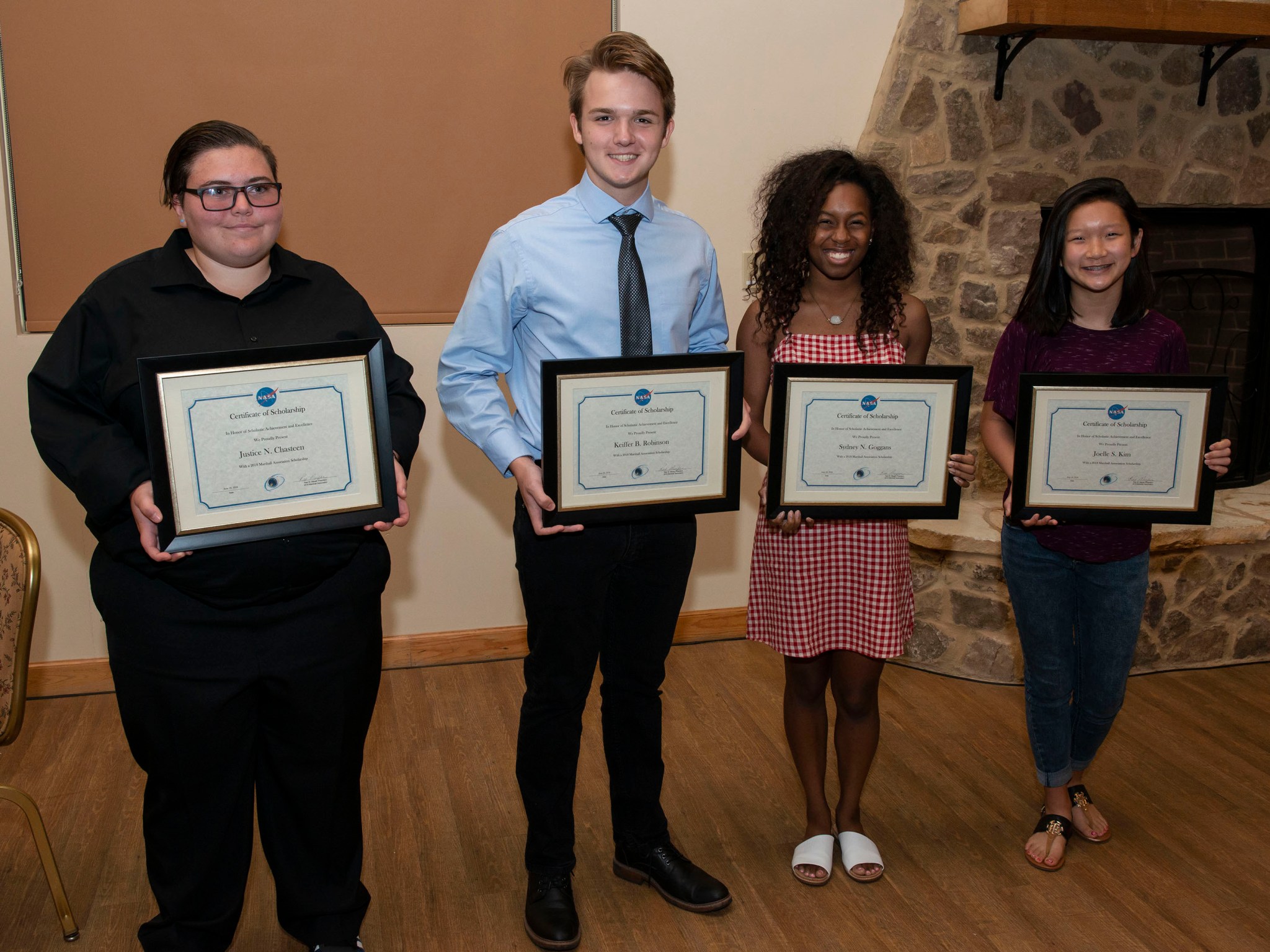 Marshall Association scholarship recipients display their scholarship certificates at the June 20 luncheon. 