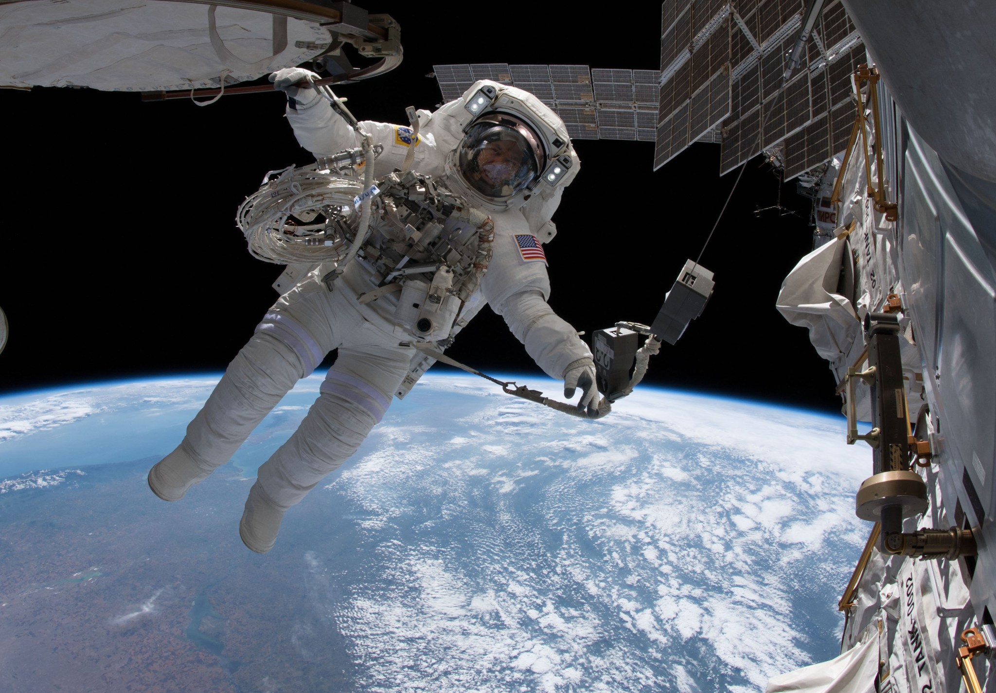 Expedition 56 Commander Drew Feustel is tethered to the International Space Station June 14 during a spacewalk.