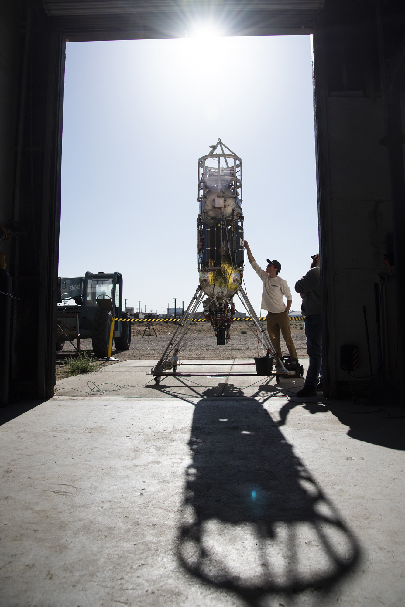 Masten Space Systems technicians checking Xodiac rocket.