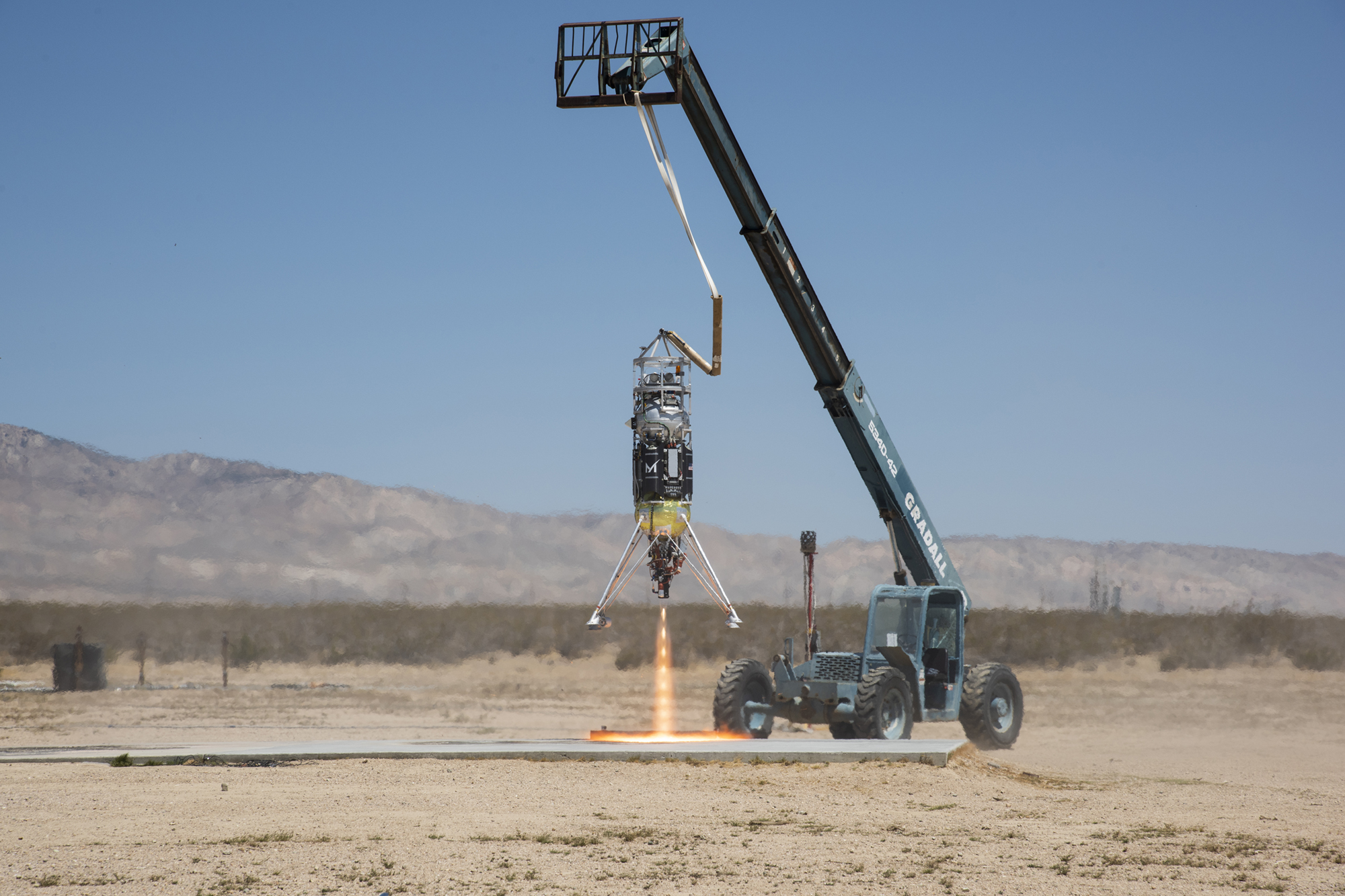 Masten Space Systems’ Xodiac rocket flight tests Honeybee Robotics pneumatic sampler collection system.