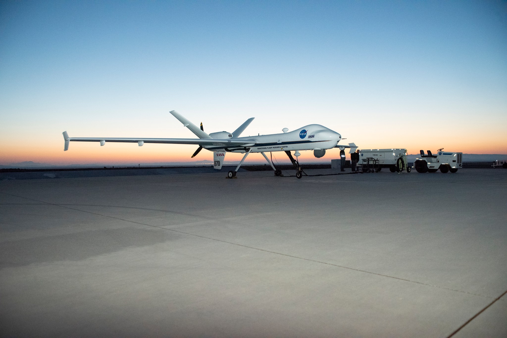 Sun Rises over NASA’s Ikhana Aircraft as Armstrong Maintenance Crews Prepare the Aircraft for a Test Flight