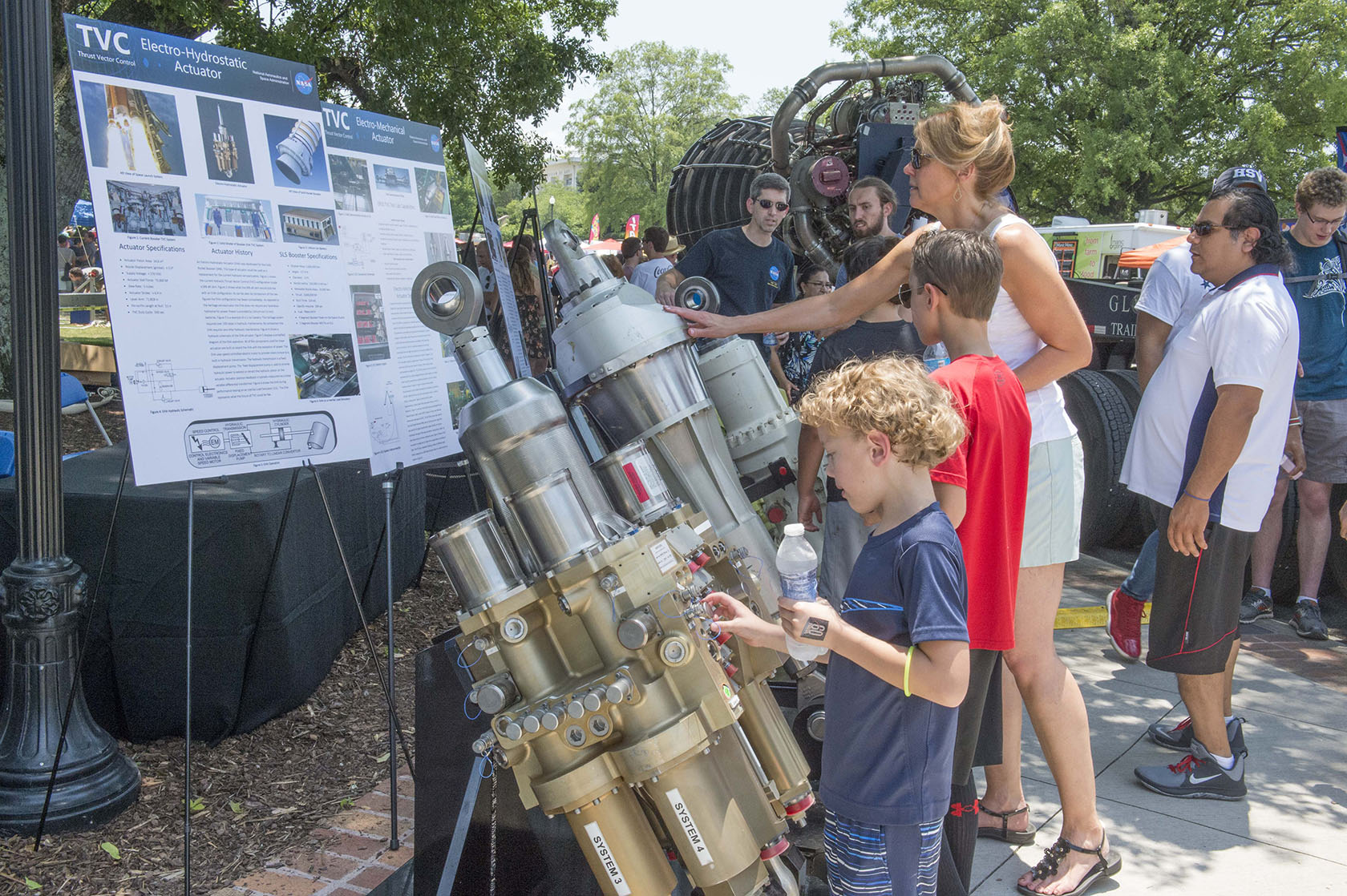 Visitors at NASA in the Park learn about Thrust Vector Control, which will steer NASA's Space Launch System rocket.