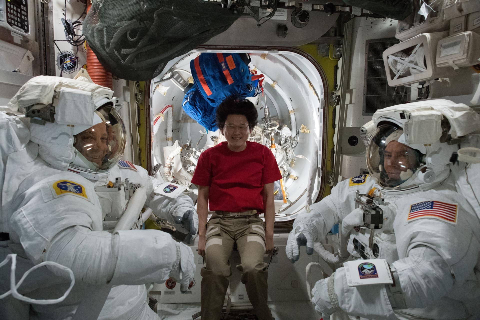 Expedition 56 NASA astronauts Ricky Arnold (left) and Drew Feustel (right) are pictured with Norishige Kanai (center) from JAXA
