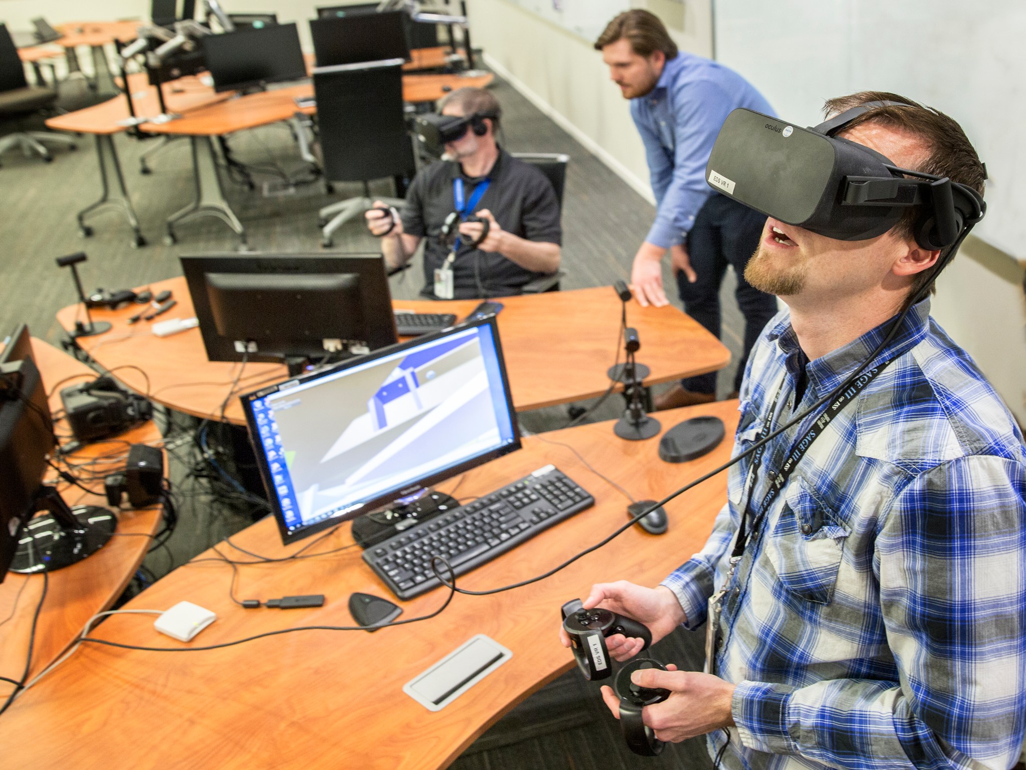Engineers try out virtual reality design software in NASA Langley's Engineering Design Studio.
