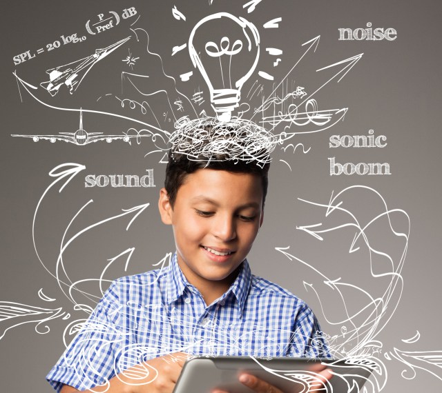 Chevron Educational Cover (Boy holding a tablet with lines and drawings coming out of the tablet surrounding him)