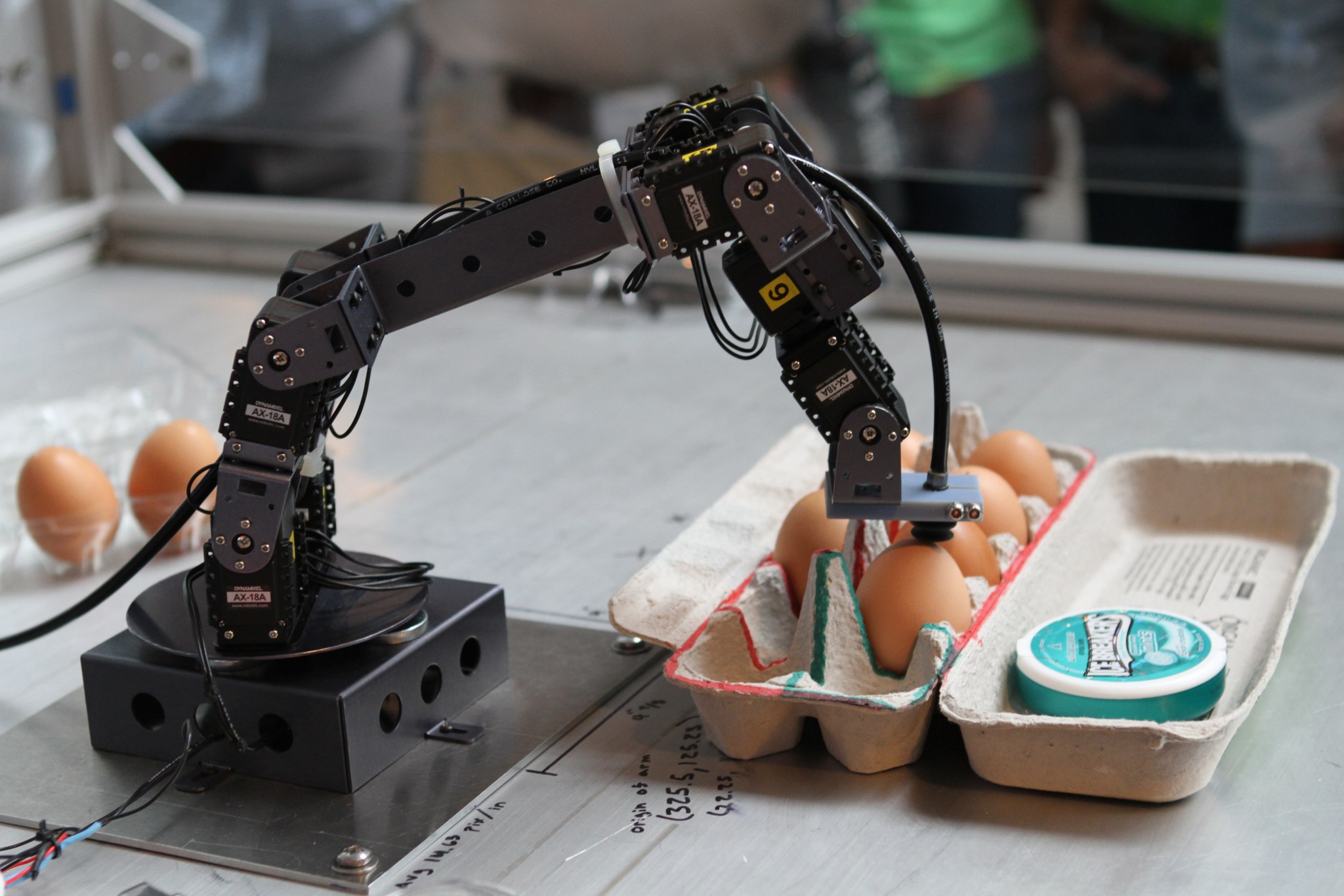  robotic arm and a carton of eggs