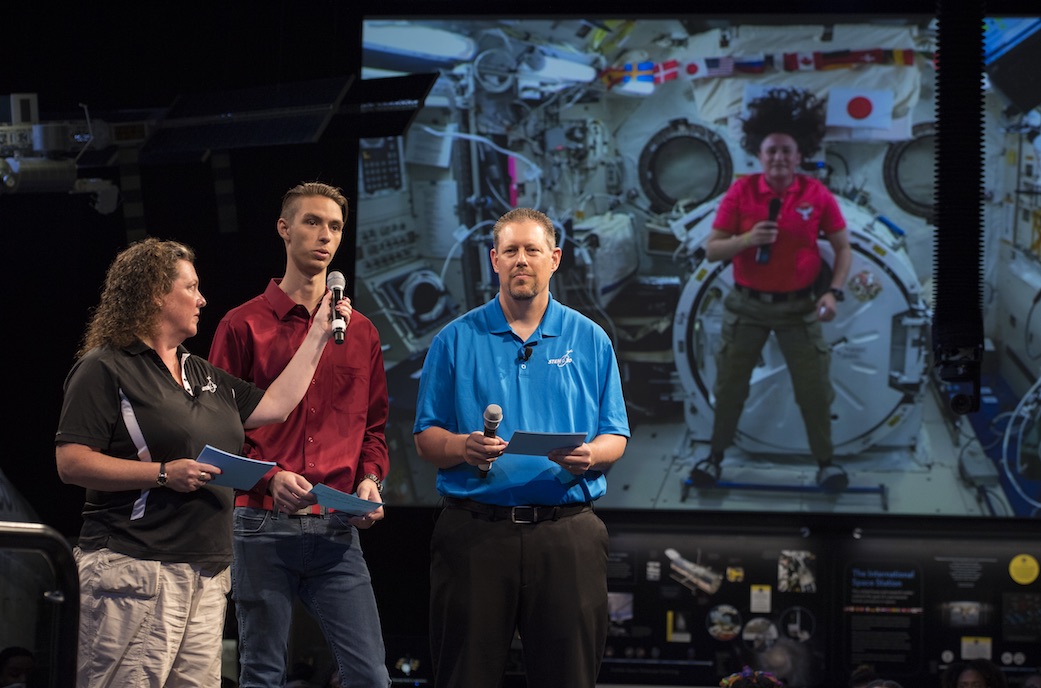 Austin Suder asks NASA astronaut Serena Auñon-Chancellor a question during a live downlink with the International Space Station