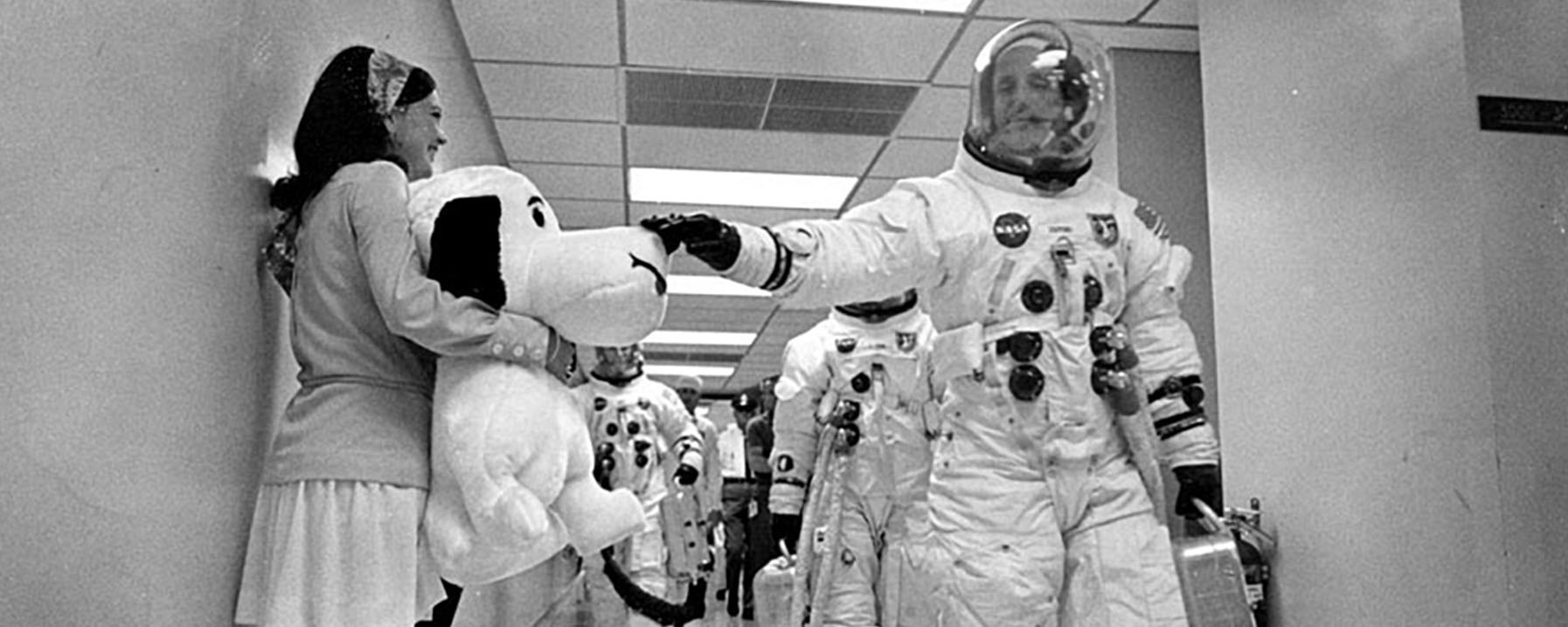 Astronauts in Suits Petting a Stuffed Animal