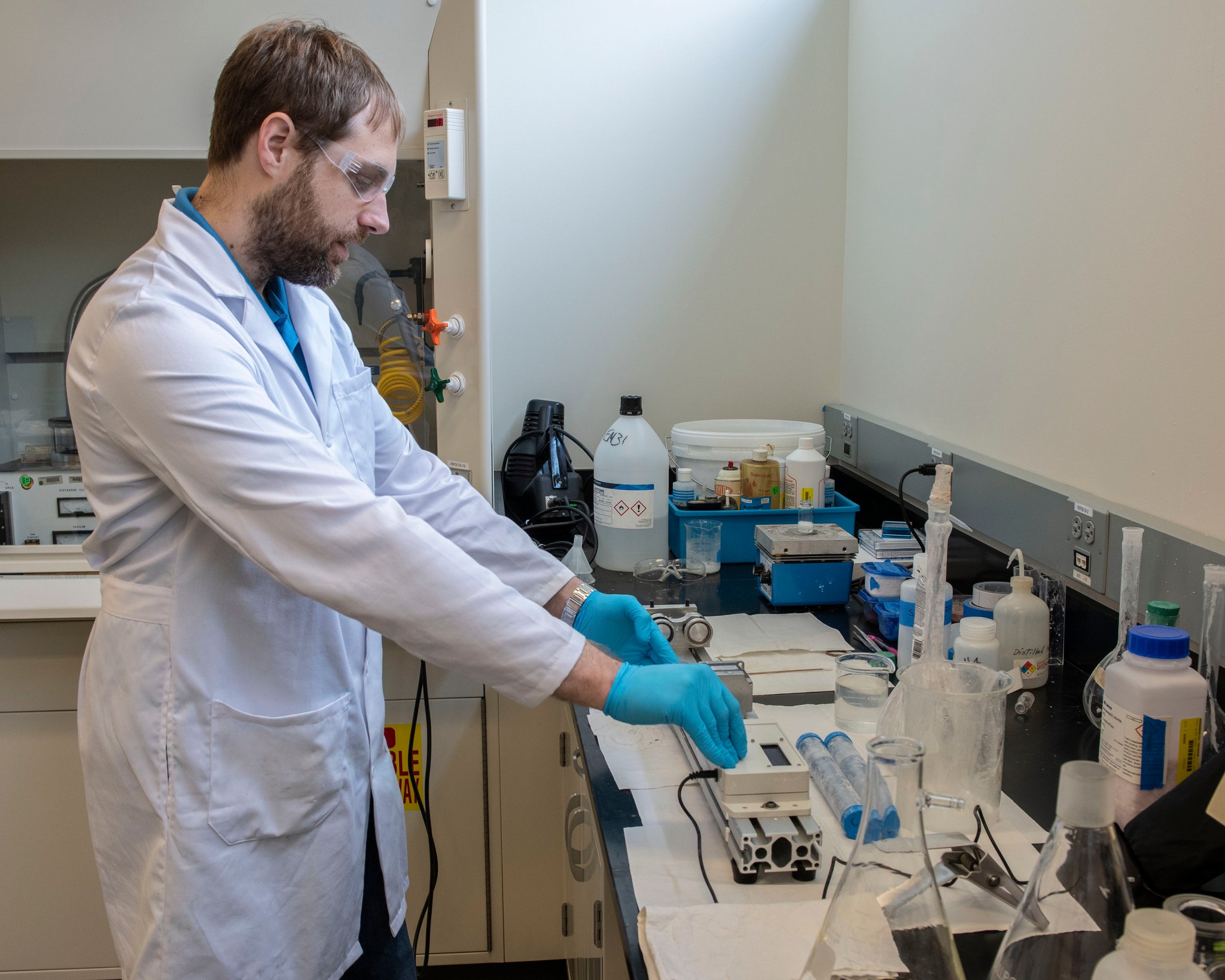 Alexander Blanchard conducts analysis in a Marshall laboratory on the Chemical Gardens experiment.