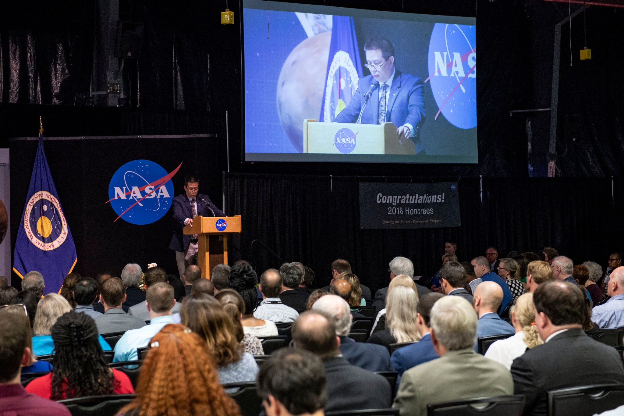 Eugene Tu, director of NASA's Ames Research Center, addresses honorees Aug. 22 at the 2018 Honor Awards ceremony at Marshall.