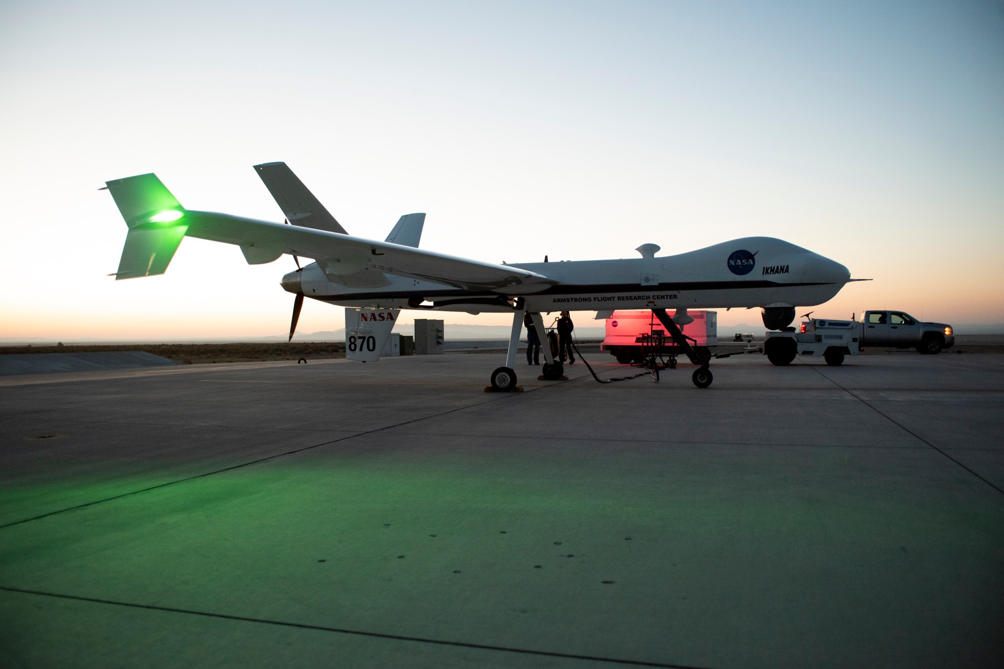 Aircraft maintenance crews at NASA‘s Armstrong Flight Research Center prepare the remotely-piloted Ikhana aircraft