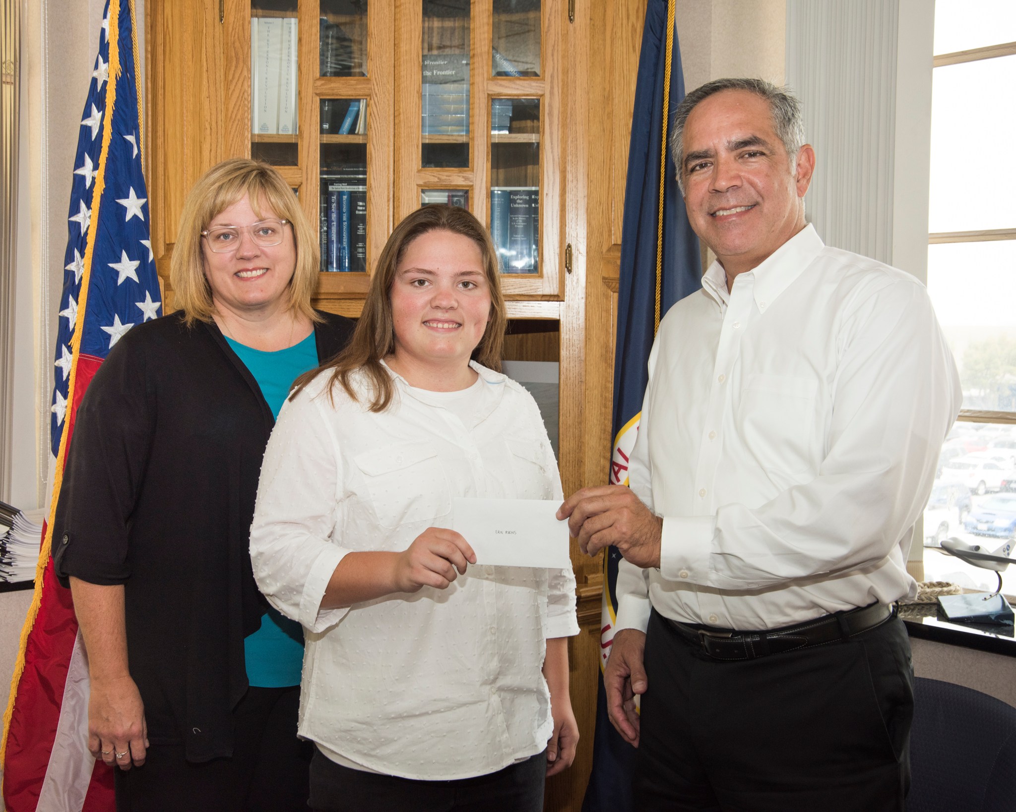 Erin Askins accepts the 2018 NASA Armstrong Exchange Harold W. Walker Memorial Scholarship from Center Director David McBride.