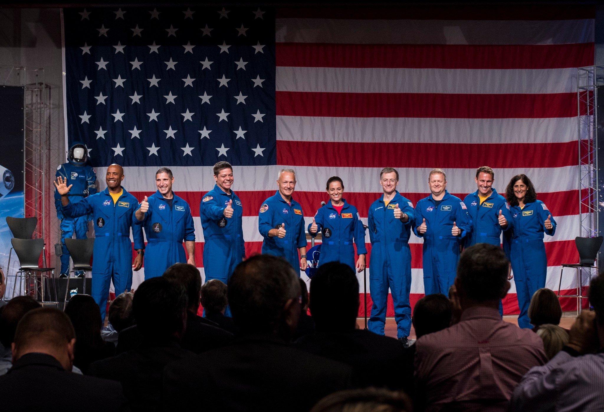 The first U.S. astronauts who will fly on American-made, commercial spacecraft to and from the ISS wave after announcement.