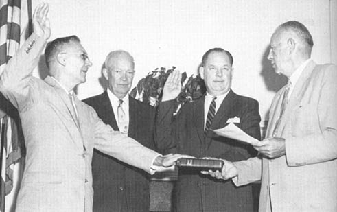 Dryden and Glennan being sworn in by President Eisenhower.