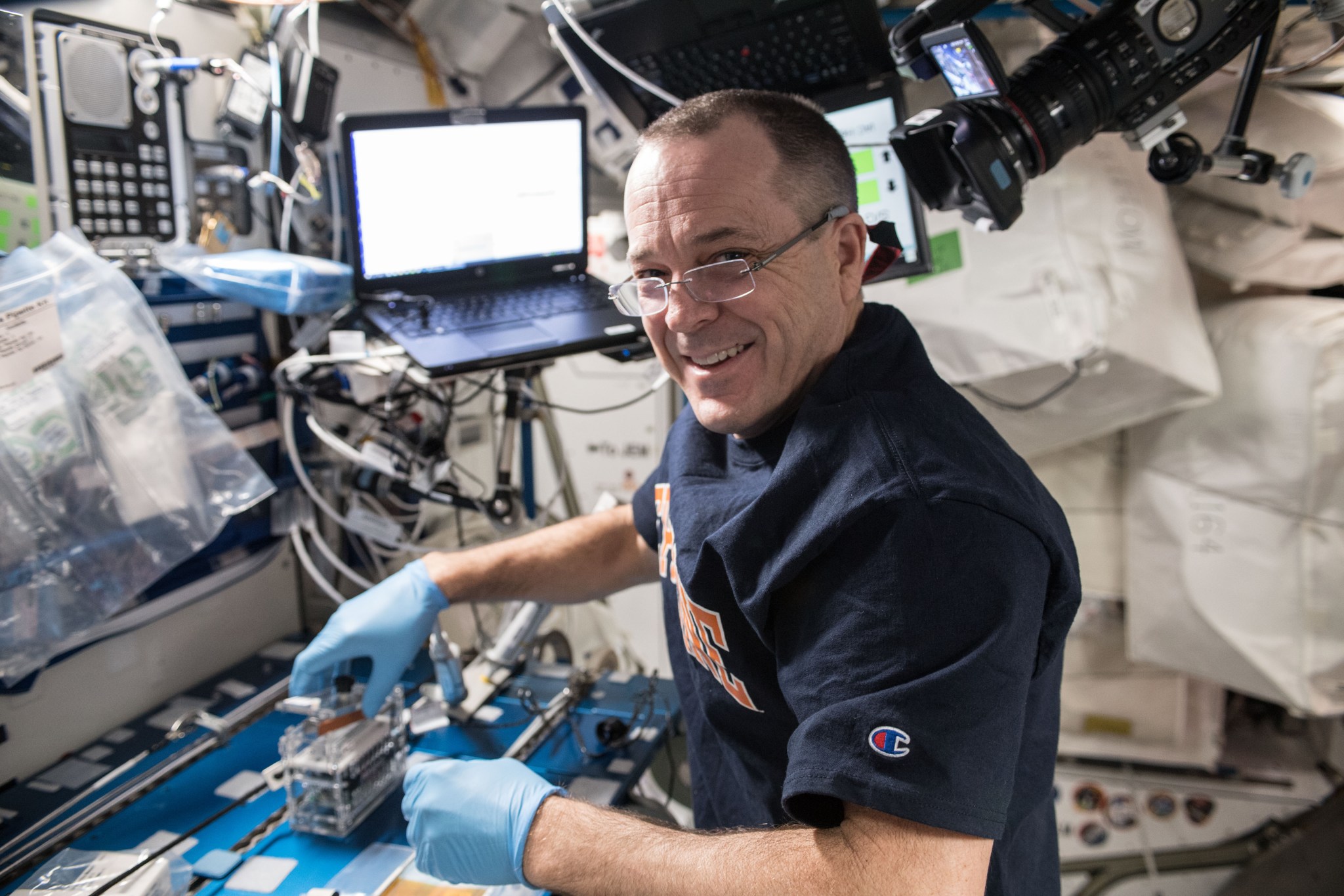 NASA astronaut Ricky Arnold processes microbial DNA