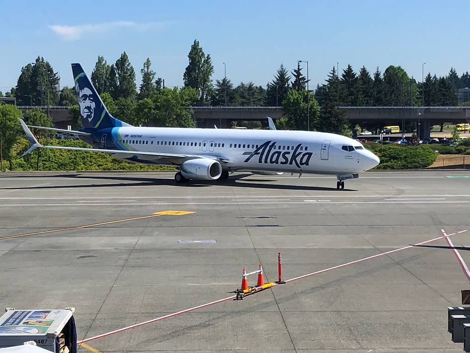 An Alaska Air plane on the tarmac.