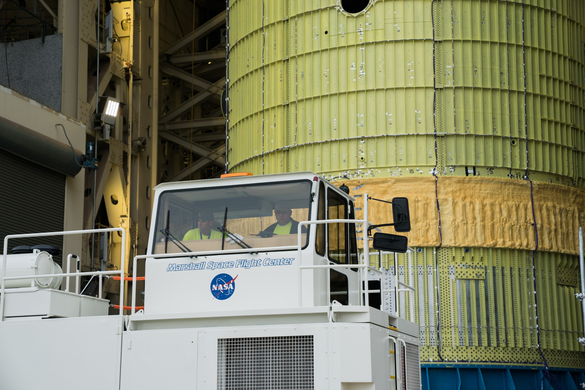 Using a specialized truck, structural test hardware for NASA's Space Launch System is moved.