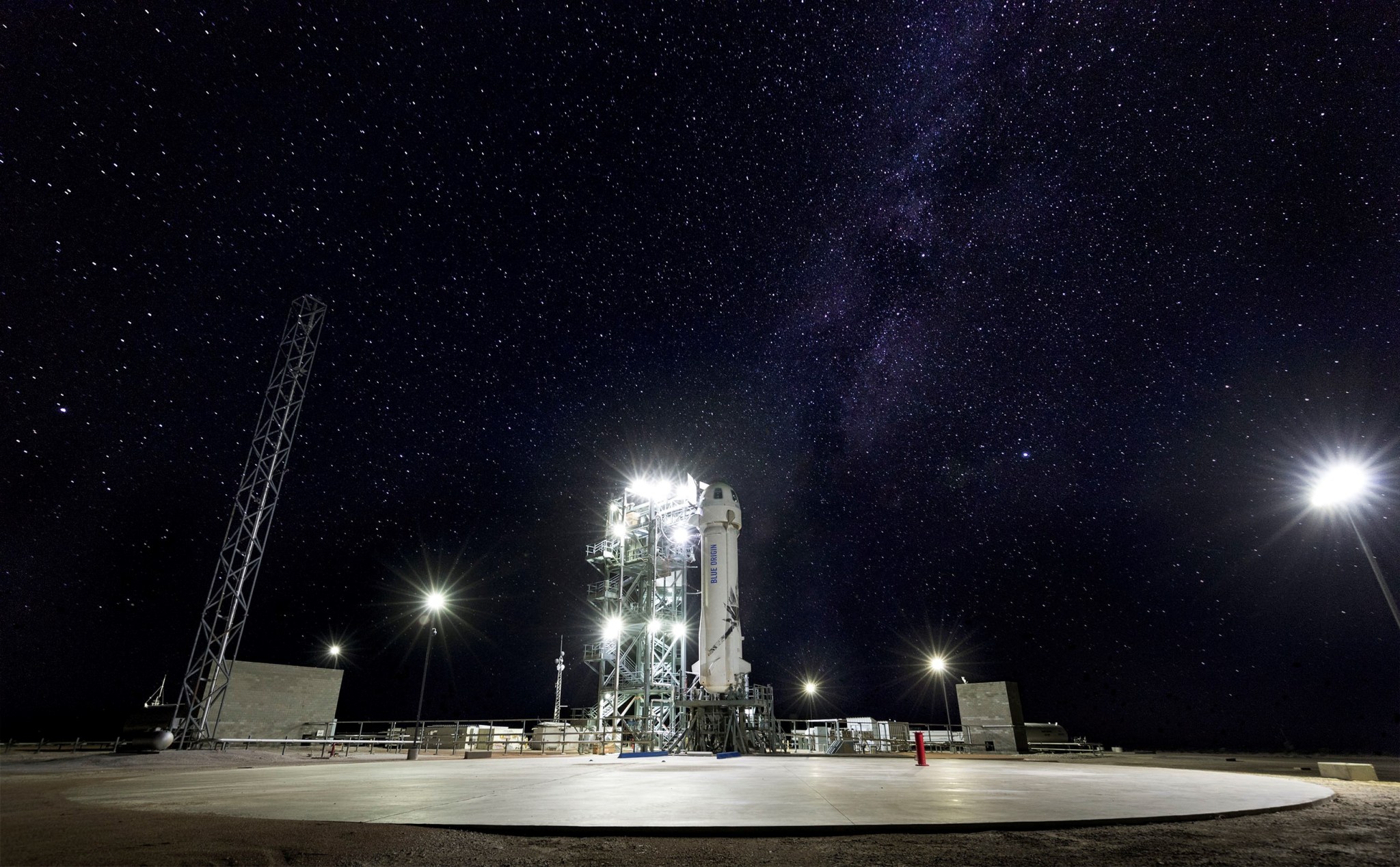 Blue Origin’s New Shepard rocket on the launchpad with night sky in background