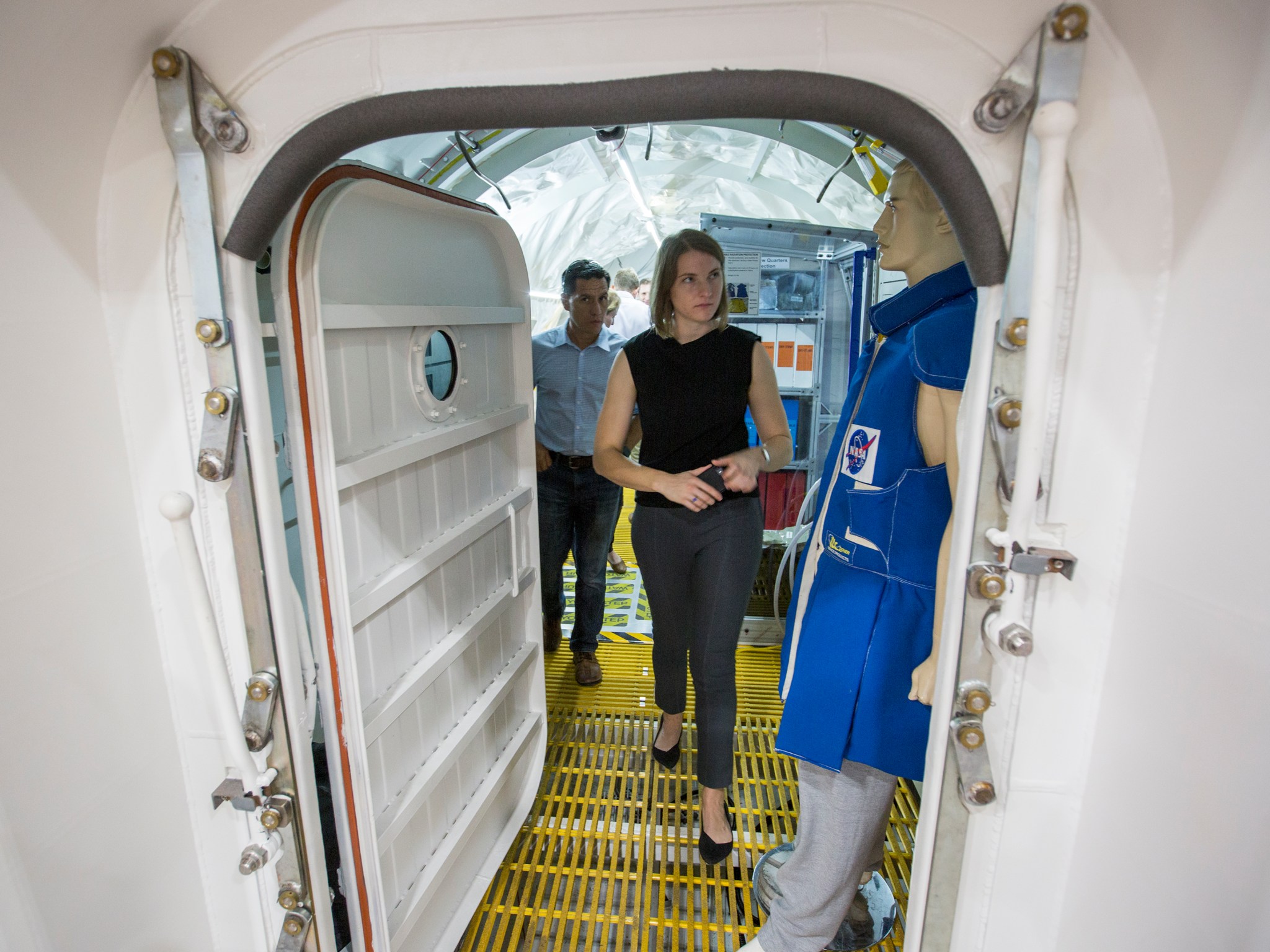 Raja Chari, left, and Kayla Baron take a look inside an expandable habitat model during their visit to NASA Langley.