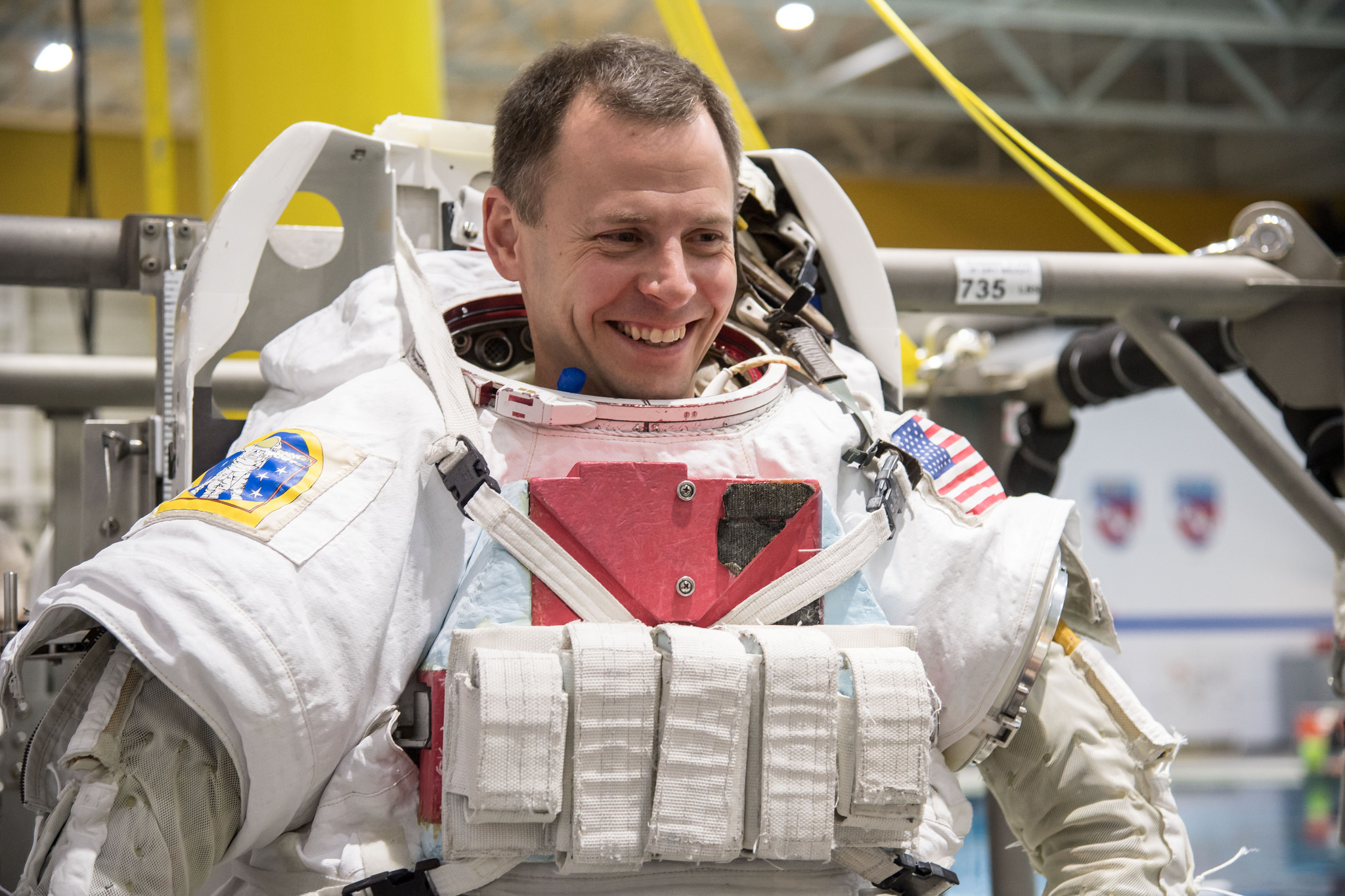 NASA astronaut Nick Hague, seen here getting into a spacesuit for spacewalk training on Dec. 7, 2017.