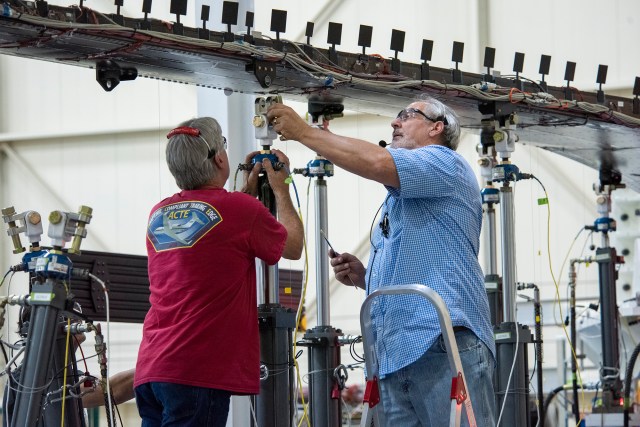 Wally Hargis, left, and Ted Powers complete preparations for testing the Passive Aeroelastic Tailored wing.