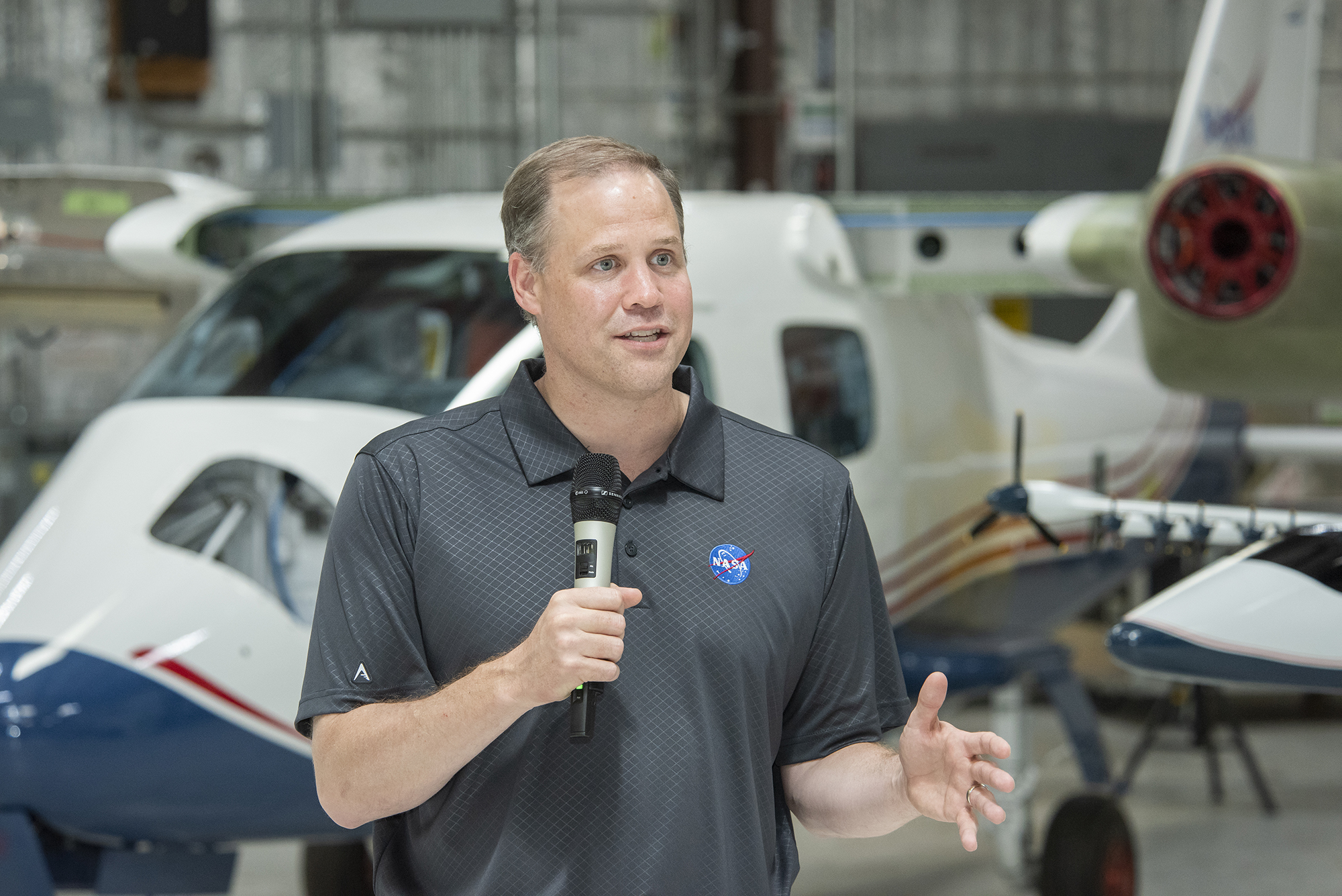 NASA Administrator Bridenstine talks to press in front of X-57.