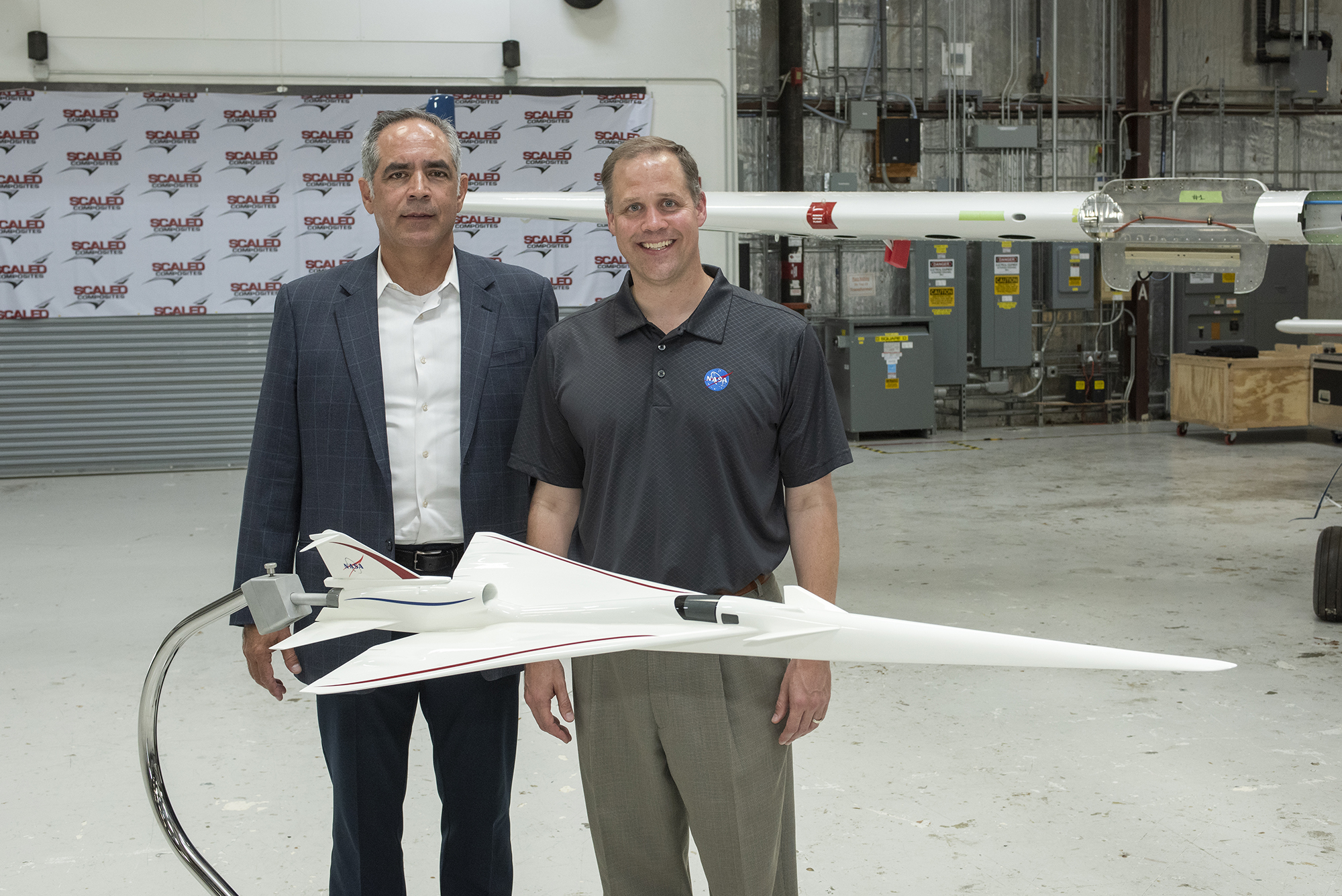 NASA Administrator Bridenstine stands with AFRC center director McBride by model NASA?s Supersonic X-Plane.
