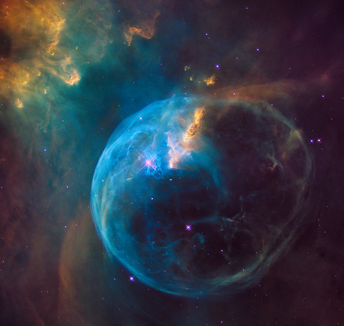A zoom into the Hubble Space Telescope photograph of an enormous, balloon-like bubble being blown into space by a super-hot, mas