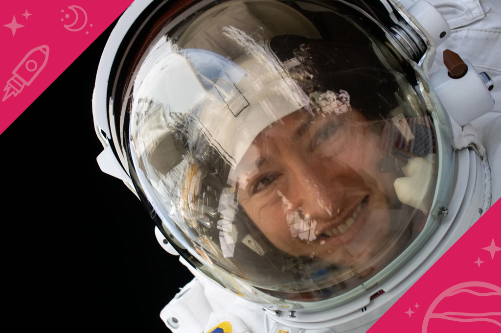 A close up photo of NASA astronaut Christina Koch smiling during a spacewalk