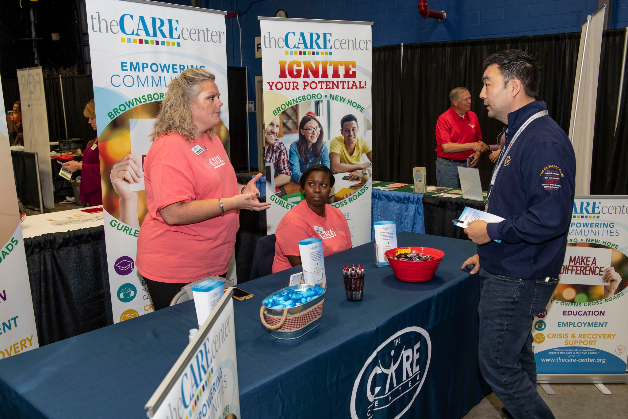 Marshall’s Mat Park, right, talks with Andrea Bridges, left, and Aneisha Nolen, both of The CARE Center in Huntsville.