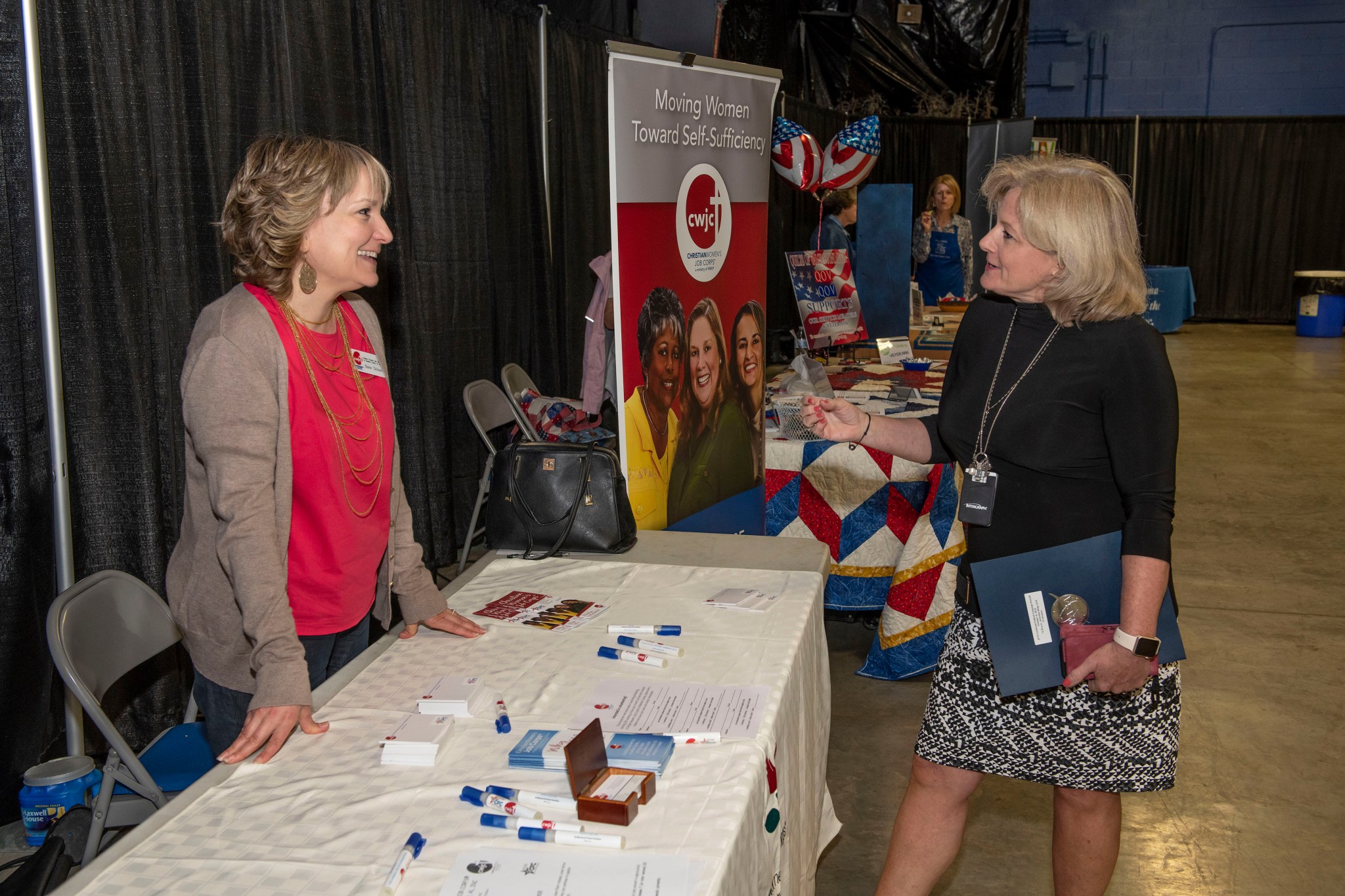 Marshall Director Jody Singer talks with Elaine Dickson, executive director of the Christian Women’s Job Corps in Huntsville.
