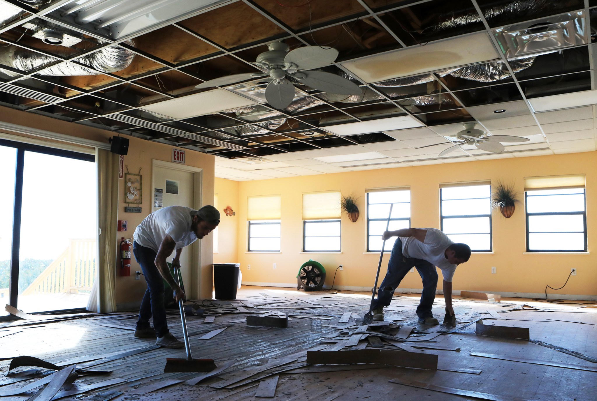The Disaster Assessment and Recovery Team works on flooring repairs 