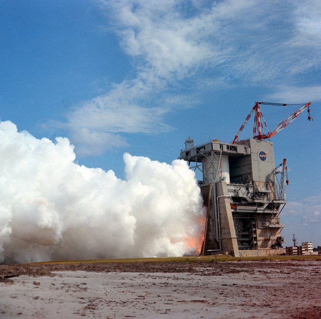 This photograph shows a test firing of the Saturn V S-II (second) stage at the Mississippi Test Facility's (MTF) S-II test stand in 1967. When the Saturn V booster stage (S-IC) burns out and drops away, power for the Saturn will be provided by the 82-foot-long and 33-foot-diameter S-II stage.