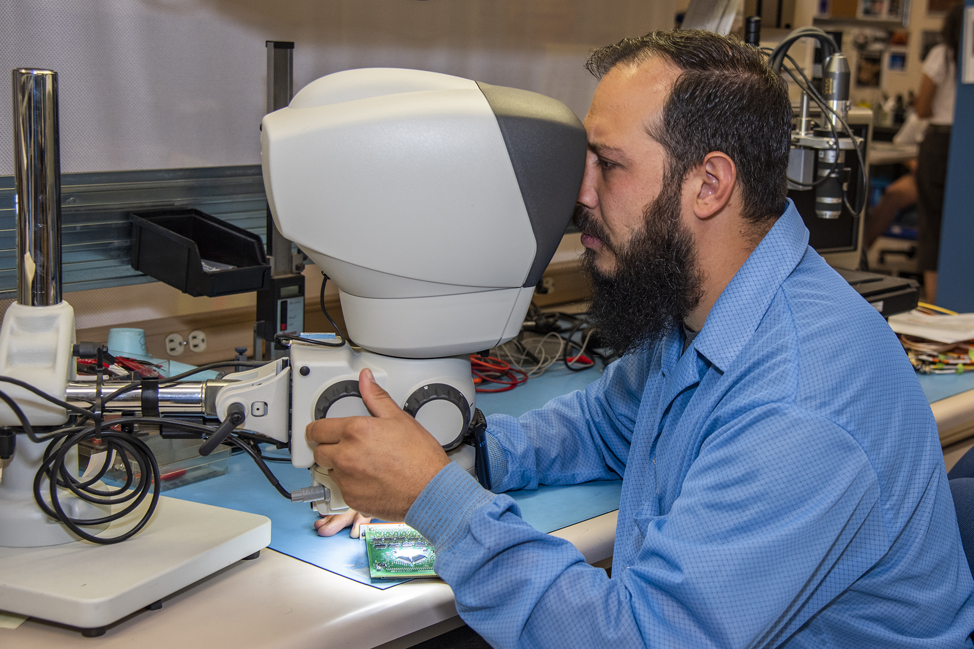 Clark Johnson inspects components tested in the Environmental Laboratory at NASA’s Armstrong Flight Research Center.